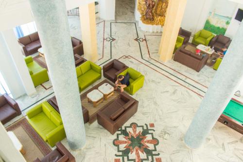an overhead view of a living room with green furniture at Hotel Dreams Beach in Hammam Sousse