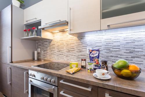 Virtuvė arba virtuvėlė apgyvendinimo įstaigoje Perunova Apartments