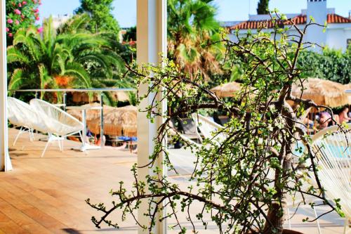 a group of chairs and tables on a patio at Hotel Vista Odin in Playa de Palma