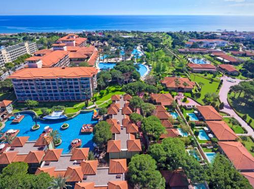 an aerial view of a resort with boats in the water at IC Hotels Green Palace - Kids Concept in Lara