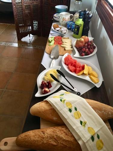 a table topped with lots of different types of food at El Amparo in Alhama de Granada