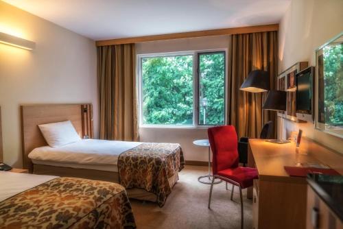 Posteľ alebo postele v izbe v ubytovaní Hotel HP Park Poznań Malta