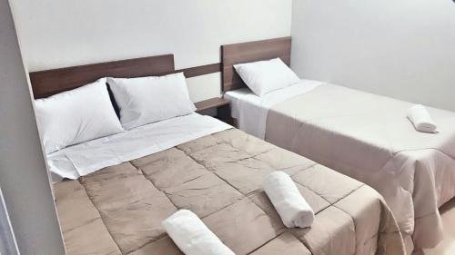 เตียงในห้องที่ Hotel Sur Brasil