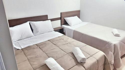 Postel nebo postele na pokoji v ubytování Hotel Sur Brasil