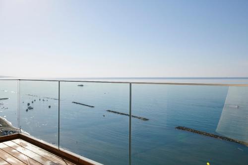 a view of the ocean from the balcony of a house at Olympic Residence Deluxe Apartments in Limassol