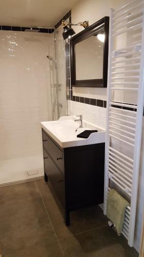 a bathroom with a sink and a mirror at De nussi's chalet 3 in Bach