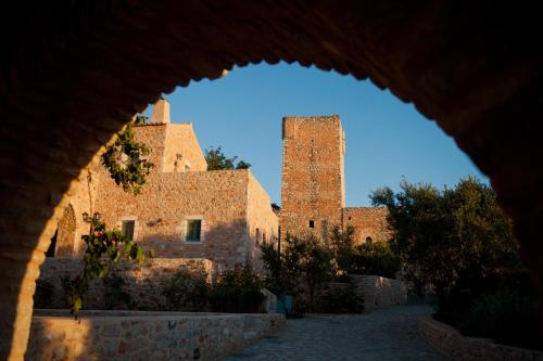 an archway view of a building with two towers at Pandora in Pirgos Dhirou