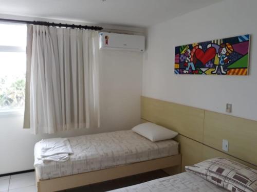 En eller flere senge i et værelse på Gran Lençóis Flat Residence 603 M