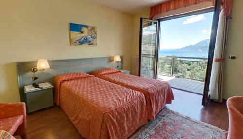 Postel nebo postele na pokoji v ubytování Hotel Bellavista