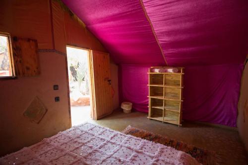 Ecolodge La Palmeraieにあるベッド