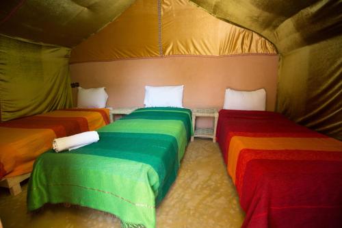 Ecolodge La Palmeraieにあるベッド