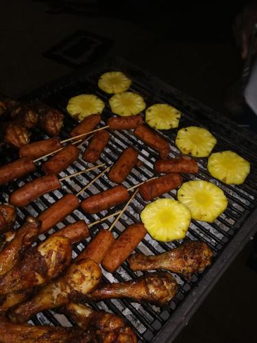 a grill filled with lots of different types of food at Hidden Jungle Village in Wilpattu