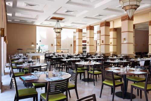 a dining room filled with tables and chairs at Valeria Madina Club - All Inclusive in Marrakech