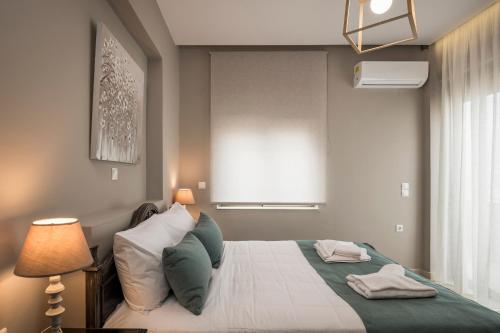 Postel nebo postele na pokoji v ubytování Mirma Luxury Apartment