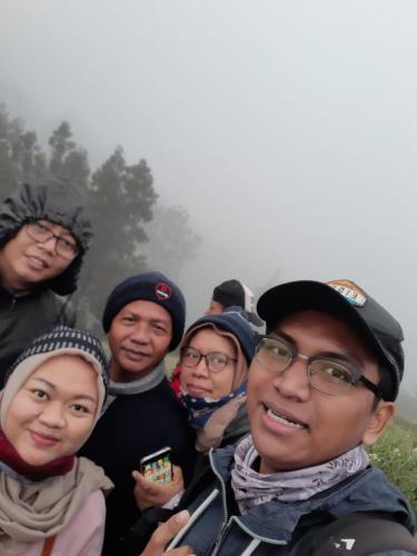 a group of people posing for a picture at Budhis Home in Bromo