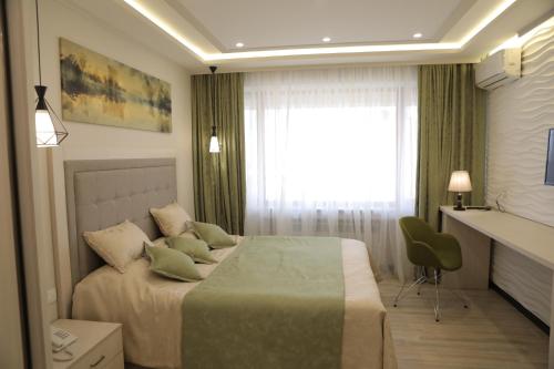 4Room Hotel tesisinde bir odada yatak veya yataklar