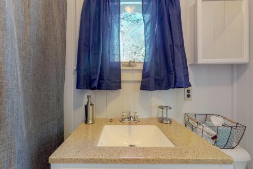 a bathroom with a sink and a window at Toddy Pond Jack in Orland