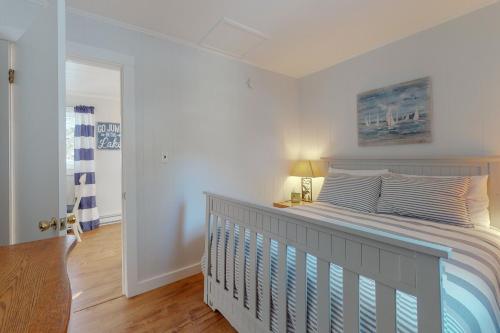 a bedroom with a bed and a lamp and a door at Toddy Pond Jack in Orland