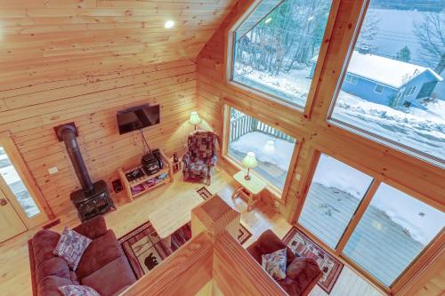 an overhead view of a living room in a log cabin at Contemporary ADK 5 Bedroom Chalet on Schroon in Schroon Lake
