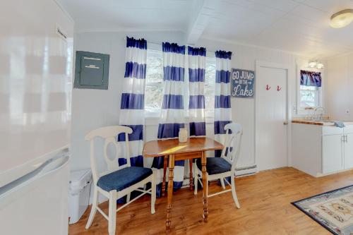 a kitchen and dining room with a table and chairs at Toddy Pond Jack in Orland