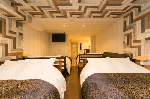 Ένα ή περισσότερα κρεβάτια σε δωμάτιο στο R Hotel Chiba sta 1min 2019 Open