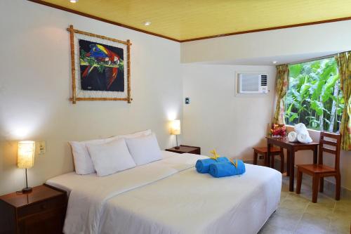 Tempat tidur dalam kamar di Ceiba Tops