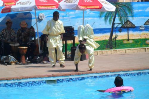 a group of people standing in a swimming pool at Hôtel - Appartement meublé " LES FLOTS BLEU " in Antananarivo