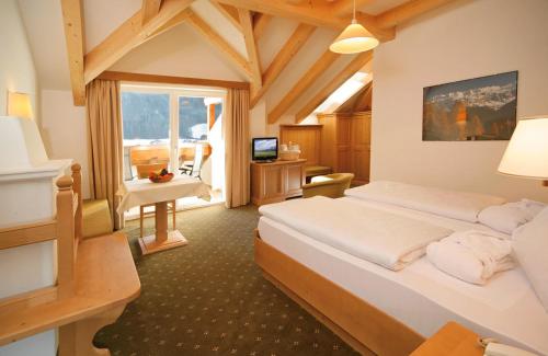Postel nebo postele na pokoji v ubytování Hotel Grones