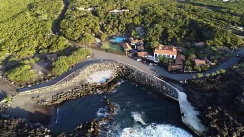 an aerial view of a house next to the ocean at Pocinhobay in Madalena