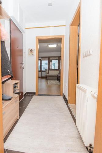a hallway with a door leading to a living room at Apartment Hobbit - Bjelašnica in Bjelašnica