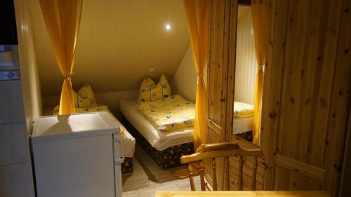 a small room with two twin beds in it at Pension im Glück Thale in Thale