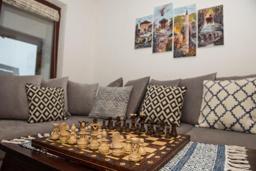 a chess board on a table in a living room at Apartment Hobbit - Bjelašnica in Bjelašnica
