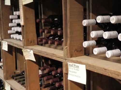 a bunch of bottles of wine on display at Gasthof Löwen, Heitersheim in Heitersheim