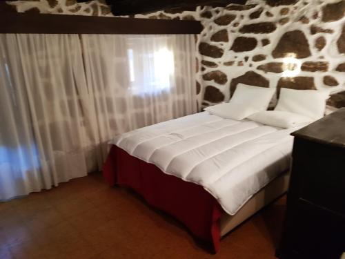 Letto o letti in una camera di Dona Gracia Belmonte