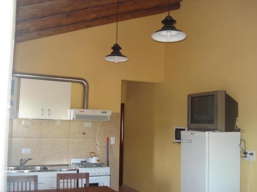 Kuchyň nebo kuchyňský kout v ubytování Complejo Mi Tesoro