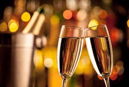 two glasses of champagne sitting next to each other at Resort Kumano Club in Kumano