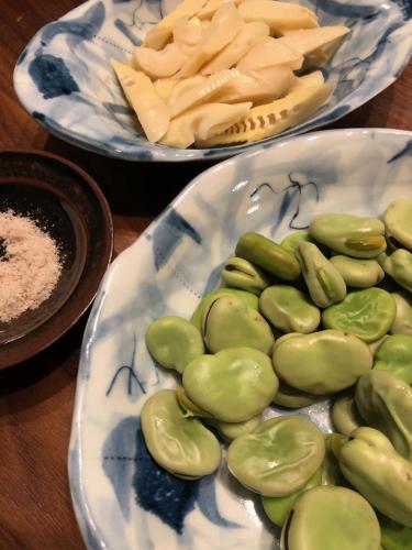 two plates of food with vegetables and cheese on a table at Share Creative&Bed adonoan in Takeo
