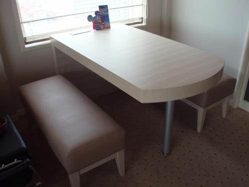 a white table and stool with a table and a window at Urayasu Brighton Hotel Tokyo Bay in Urayasu