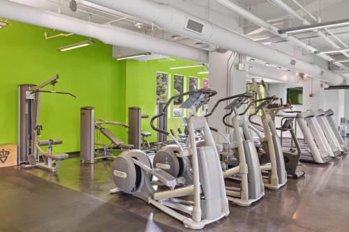 a gym with a bunch of exercise bikes in a room at Trifecta Spacious & Beautiful Wifi Superhost in Charlotte