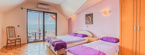 Ένα ή περισσότερα κρεβάτια σε δωμάτιο στο Hotel Mizo