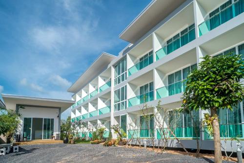 an apartment building with a lot of windows at The Tree Samui in Bophut 