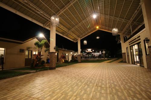 an empty arcade at night with lights on at A&A Garden Suites in Tagaytay