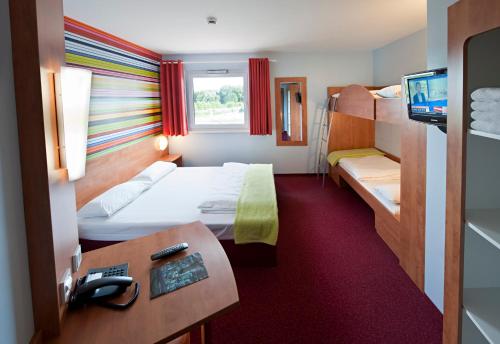 Katil atau katil-katil dalam bilik di Hotel Rhynern Nord