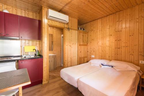 Posteľ alebo postele v izbe v ubytovaní Camping Los Llanos