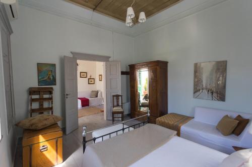 a living room with a couch and a table at Irini's house in Spetses