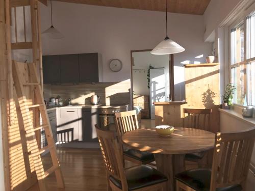 a kitchen and dining room with a table and chairs at Ferienwohnung Mountaintop in Lienz