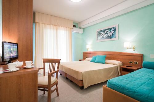 Postel nebo postele na pokoji v ubytování Hotel Al Cigno