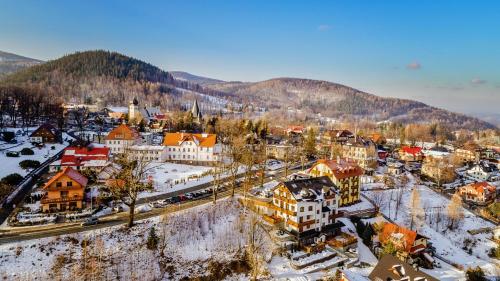 an aerial view of a town in the snow at Centrum Obrońców Pokoju, Sun & Snow in Karpacz