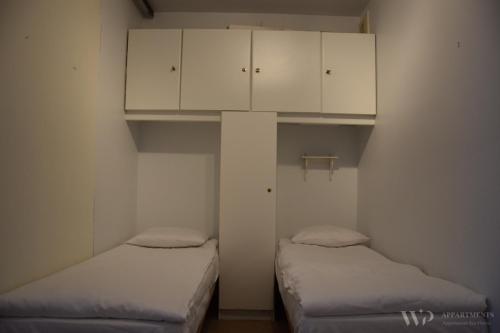 
A bed or beds in a room at Residentie Sea Flower II, 5de verdieping
