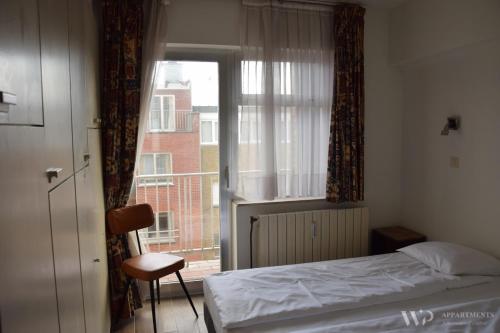 Ένα ή περισσότερα κρεβάτια σε δωμάτιο στο Residentie Caraibes, 9de verdieping